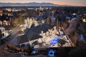Aerial view at dusk featuring a mountain view