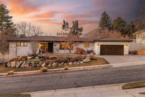 View of front facade featuring a garage