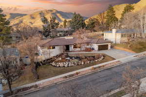 Aerial view at dusk featuring a mountain view