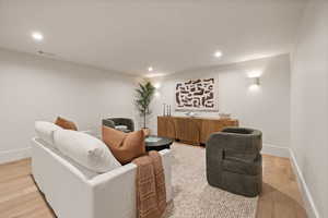 Living room with light wood-type flooring