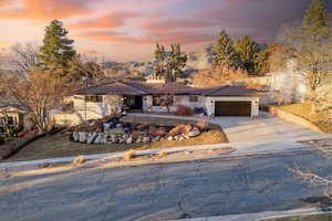 View of front facade featuring a garage