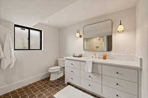 Bathroom with vanity and toilet