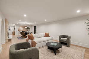 Living room with light hardwood / wood-style floors