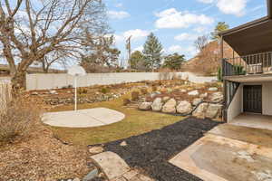 View of yard with a balcony and a patio area