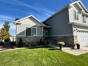 Summer View of Front Landscaping with bushes and flowers with an automatic drip watering system