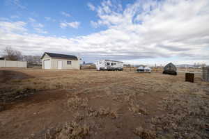 View of 2 car garage and additional parking for trailers/toys/equpment