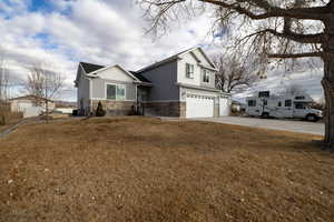 Craftsmans style home with 3 car garage and extra parking