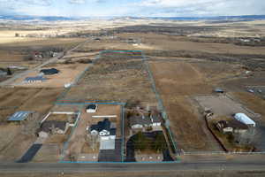 aerial view of the home on 9+acres and view of home for sale next door on .80 acres