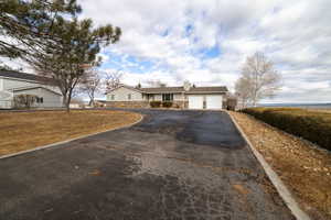 Ranch-style house featuring a 2 car garage