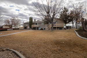 Beautiful mature landscaping with sidewalks to navigate property