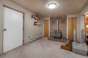 Family Room with gas fireplace, storage and exterior access to backyard