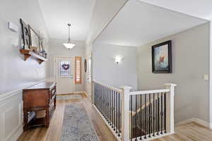 Entryway with light hardwood / wood-style floors