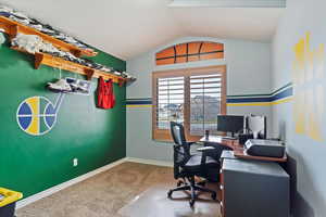 Office featuring vaulted ceiling and carpet