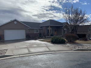 Ranch-style house featuring a garage