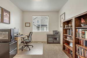 View of carpeted home office