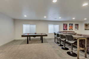 Recreation room with light colored carpet