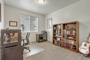 Home office with light carpet