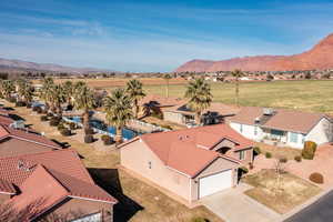 Birds eye view of property with a mountain view