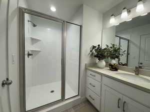 Bathroom featuring vanity and walk in shower