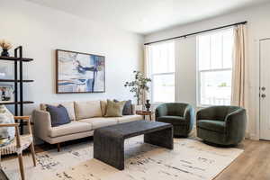 Living room with light hardwood / wood-style floors