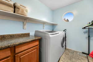 Washroom featuring washer and dryer