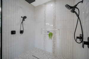 Bathroom featuring a tile shower