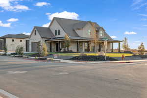 View of front facade featuring a garage