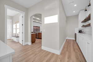 Corridor featuring light hardwood / wood-style floors