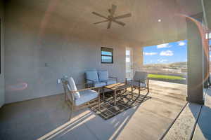 View of patio featuring an outdoor hangout area and ceiling fan