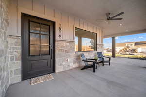 Property entrance featuring a porch and ceiling fan