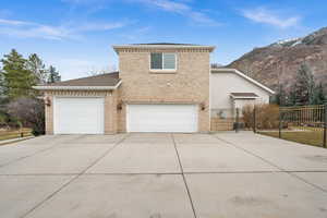 Front facade featuring a garage and a mountain view