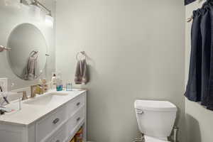 Bathroom featuring vanity and toilet