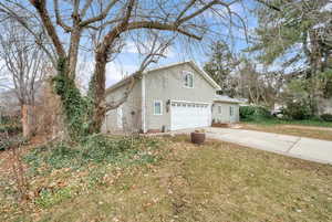 View of property exterior with a garage