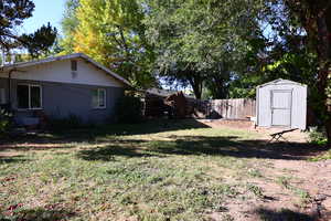 View of yard featuring a storage unit