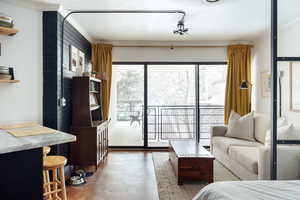 Interior space with crown molding and concrete floors