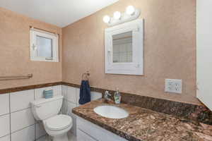 Bathroom featuring vanity and good storage.