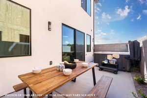 View of patio / terrace with a hot tub