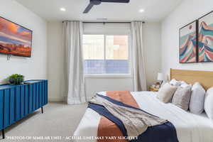 Carpeted bedroom with ceiling fan