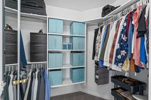 Walk in closet with carpet