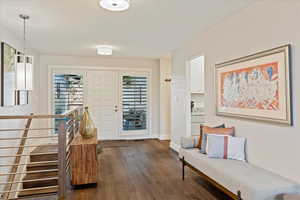 Foyer entrance featuring dark hardwood / wood-style floors