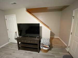 Interior details featuring hardwood / wood-style flooring