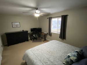 Bedroom with ceiling fan and carpet flooring