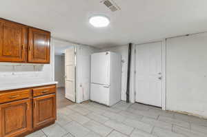 Kitchen with white refrigerator