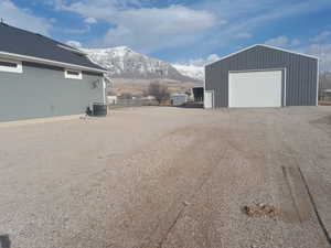 Garage with a mountain view and central AC unit