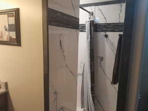 Bathroom with a shower with curtain