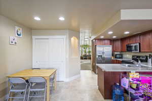 Kitchen with stainless steel appliances, sink, and kitchen peninsula