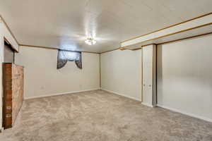 Basement with light colored carpet