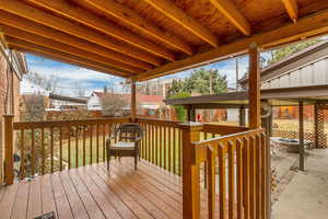 Wooden deck featuring a fire pit