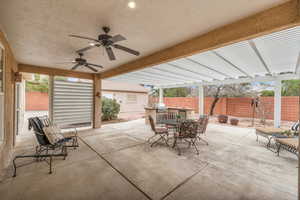 View of patio / terrace with a pergola, grilling area, and ceiling fan