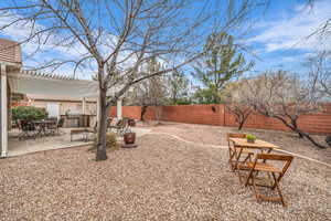 View of yard featuring a pergola, a patio, and exterior kitchen